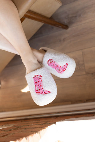 White slippers with pink cowboy boot design