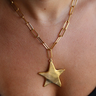 gold start pendant on large paper clip chain 