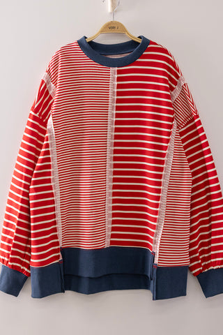 A long-sleeve crewneck sweatshirt with red and white horizontal stripes, featuring solid navy blue ribbed trim at the collar, cuffs, hem, and center front placket