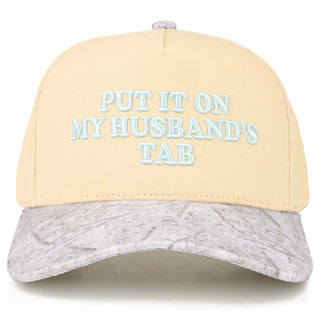 WHITE CAMO TRUCKER HAT THAT READS "PUT IT ON MY HUSBAND'S TAB" 
