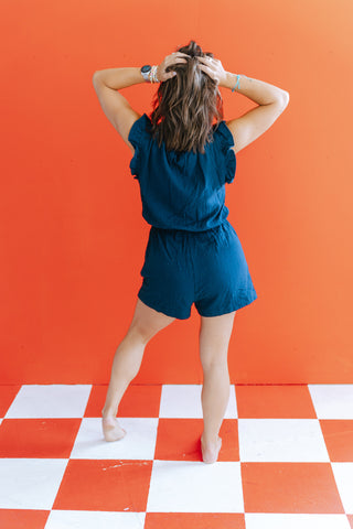 LILAH NAVY RUFFLE SLV ROMPER