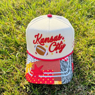 Cap with 'Kansas City' text and football graphic 