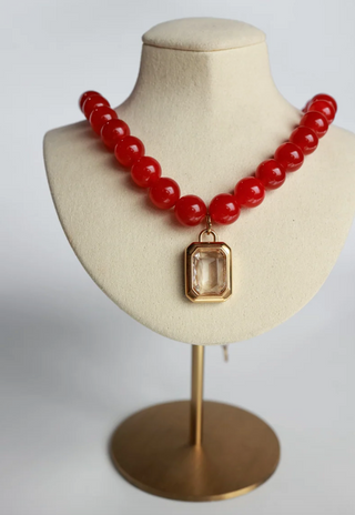 RED BEADED NECKLACE WITH LARGE RECTANGLE STONE PENDANT 
