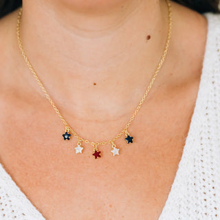 Gold necklace with colorful star pendants