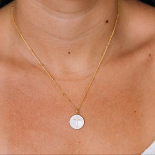 Gold necklace with a WHITE cross pendant 