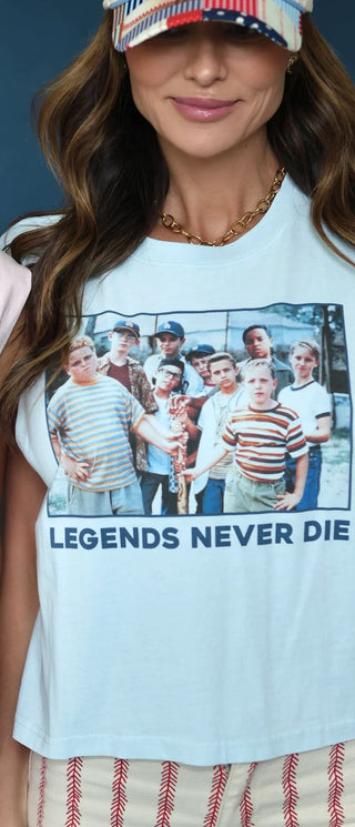 white t-shirt with a graphic design and text 'LEGENDS NEVER DIE'.