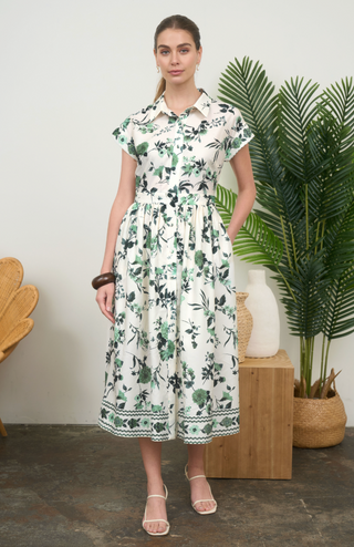 White dress with green floral pattern 