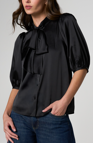 black satin-like blouse with a large bow at the collar, puff sleeves, and front buttons