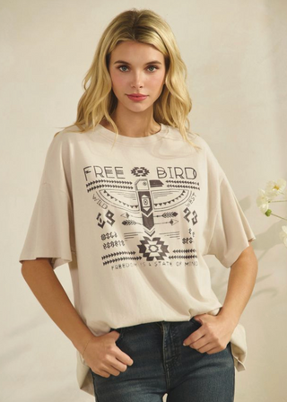BEIGE OVERSIZED GRAPHIC T-SHIRT WITH WESTERN PRINT ON IT 