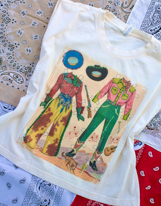 GRAPHIC MUSCLE TANK OF WESTERN DRESS UP DOLLS ON CREAM 