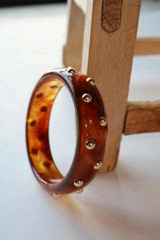 Brown tortoiseshell bangle with gold studs 