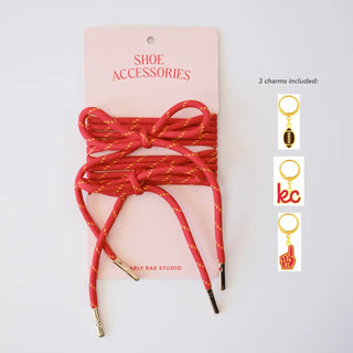 Red braided shoelaces with gold speckles, with three small charm insets on the right showing included metal charms.